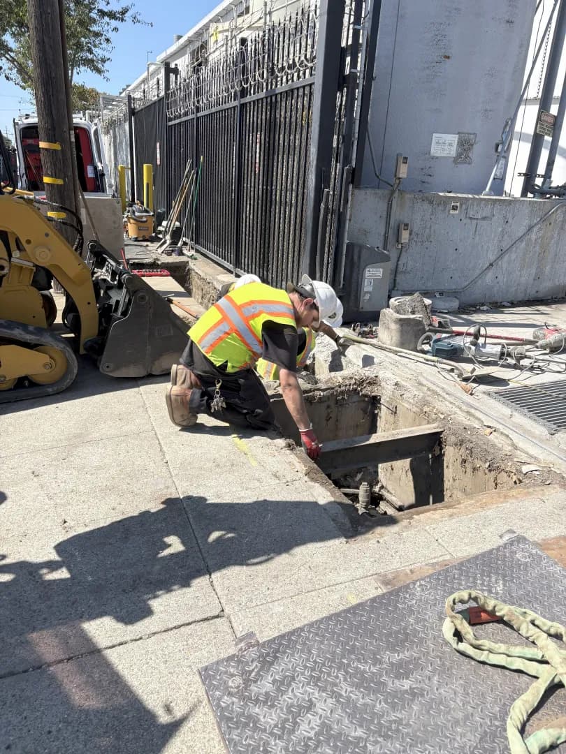 Guerra Bros. Plumbing technician performing commercial utility vault work