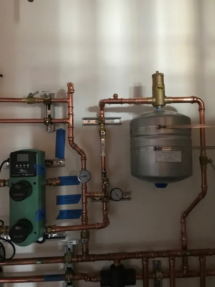 Expansion tank and Wilo circulator pump — hydronic water heater system installation