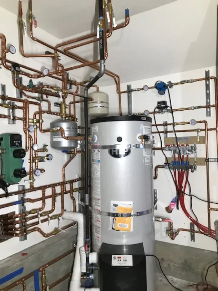 HTP water heater in mechanical room showing full system — Guerra Bros. Plumbing