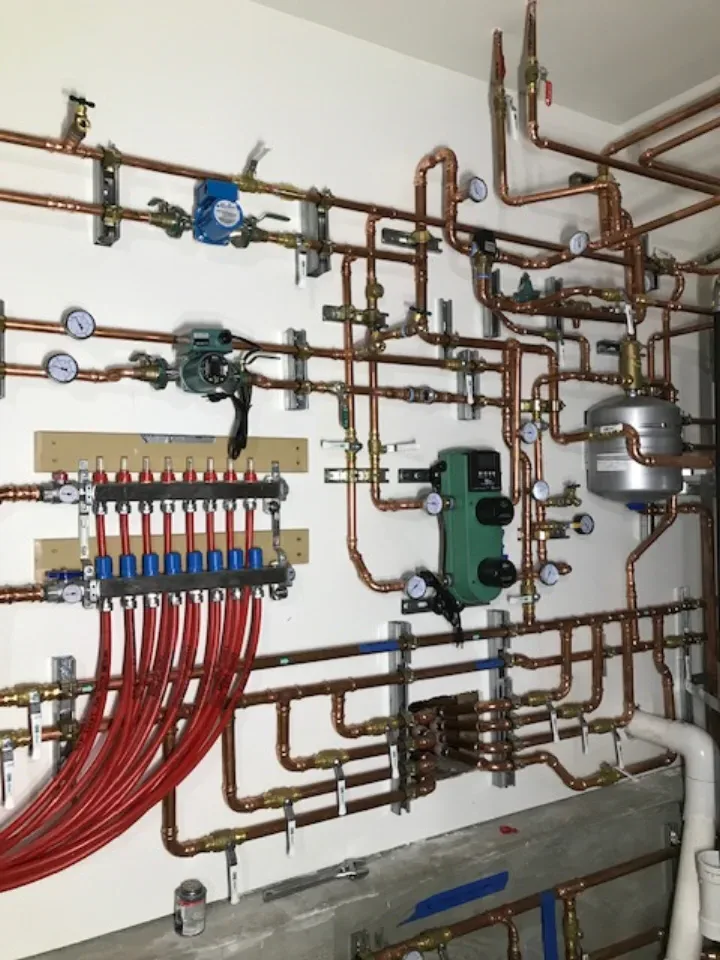 Radiant floor manifold and hydronic system — complete water heater installation